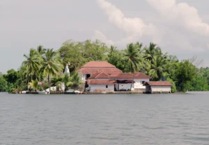 Jaliya Boat Safari group visiting the serene Kothduwa Buddhist temple located on a river island in Madu River, Sri Lanka.