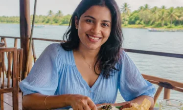 Woman enjoying a traditional Sri Lankan lunch near the Madu River
