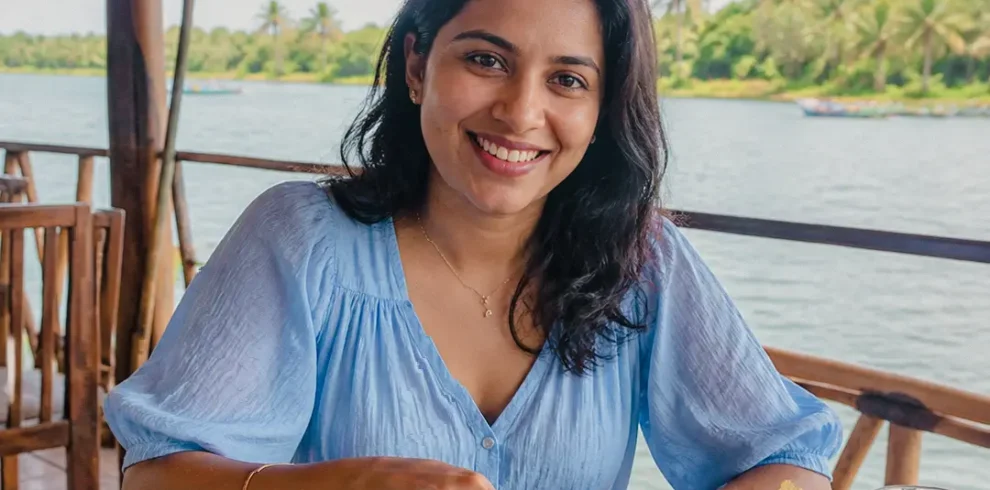 Woman enjoying a traditional Sri Lankan lunch near the Madu River
