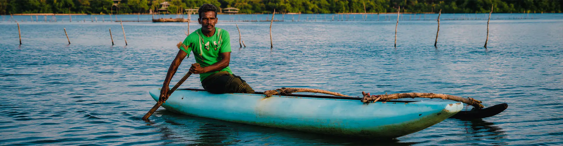 Traditional fisherman on Madu River boat safari in Balapitiya, Sri Lanka