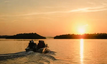 Scenic sunrise boat ride along the calm waters of the Madu River