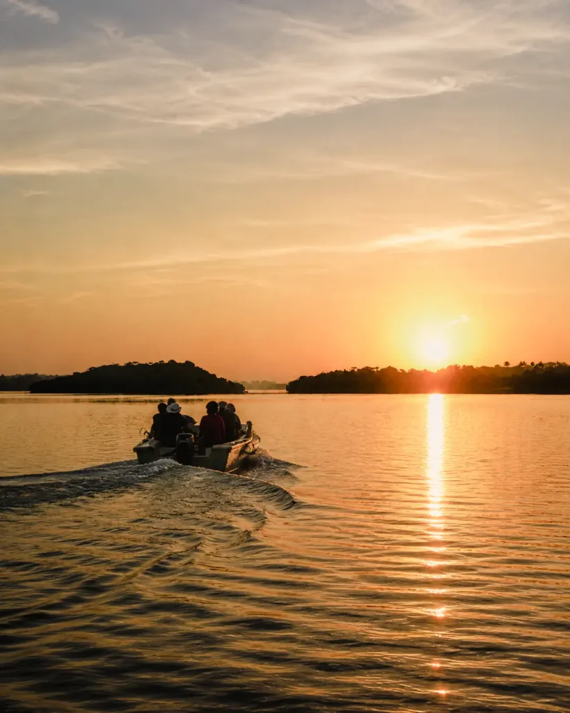 Scenic sunrise boat ride along the calm waters of the Madu River